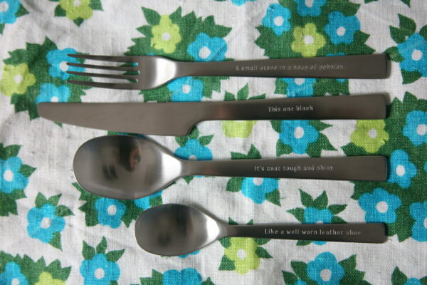 Pic of cutlery with engraved text