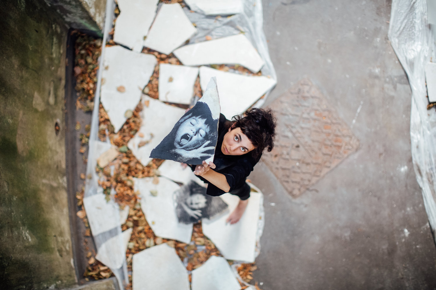 Woman holding up a stone