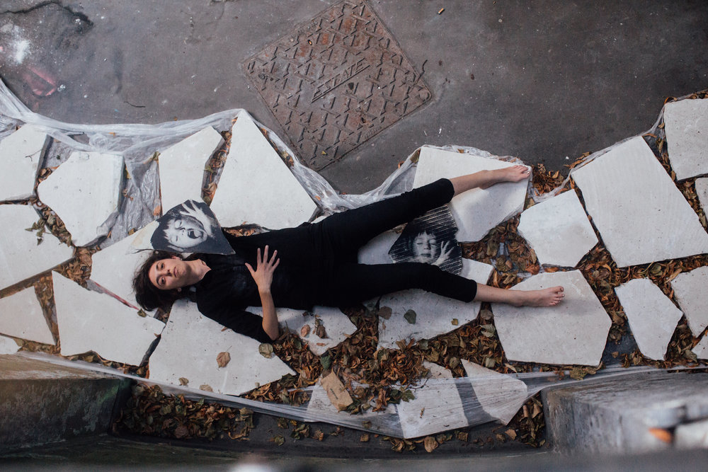 Woman lying on stones